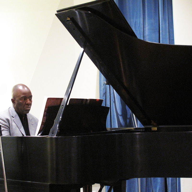 William Chapman Nyaho plays piano in the studio at Jack Straw