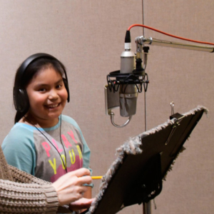 Concord student records a poem in the studio at Jack Straw, 2019