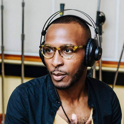 Barry Olusegun-Noble Despenza, wearing headphones