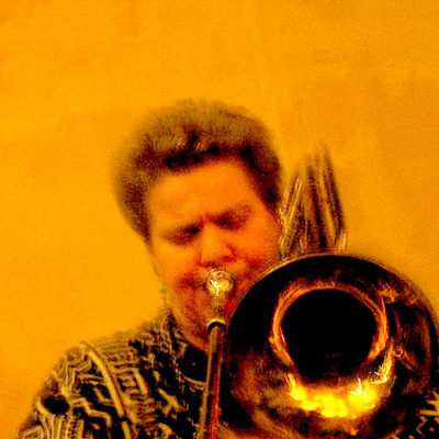 Monique Buzzarté playing trombone.