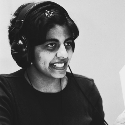 Black and white photo of Sonia Gomez, wearing headphones