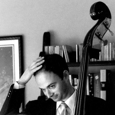 Black and white photo of Matt Weiner, holding an upright bass.