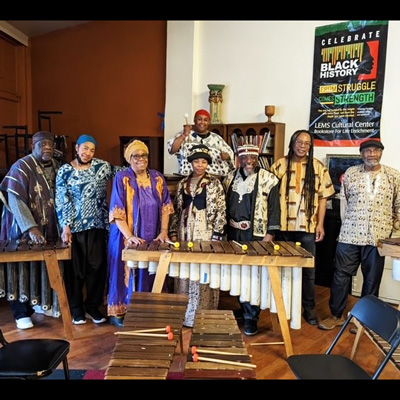 Photo of Zambuko Marimba Ensemble with four marimbas.
