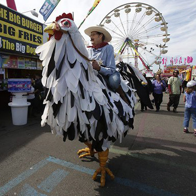 Bill Jarcho, dressed as a cowboy riding a giant chicken.