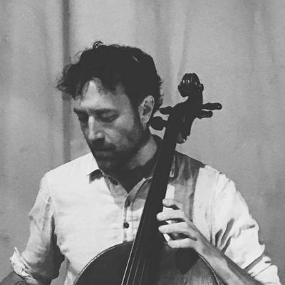 Black and white photo of Brent Arnold playing cello.