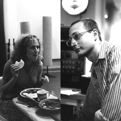 Black and white photo of Janet Wallace wearing headphones and eating in a recording studio, and Joseph Zajonc in a studio control room.