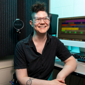 Tara Youngborg, seated in front of a computer screen displaying a digital audio workstation.