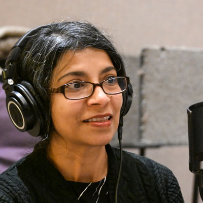 Sayantani Roy wearing headphones